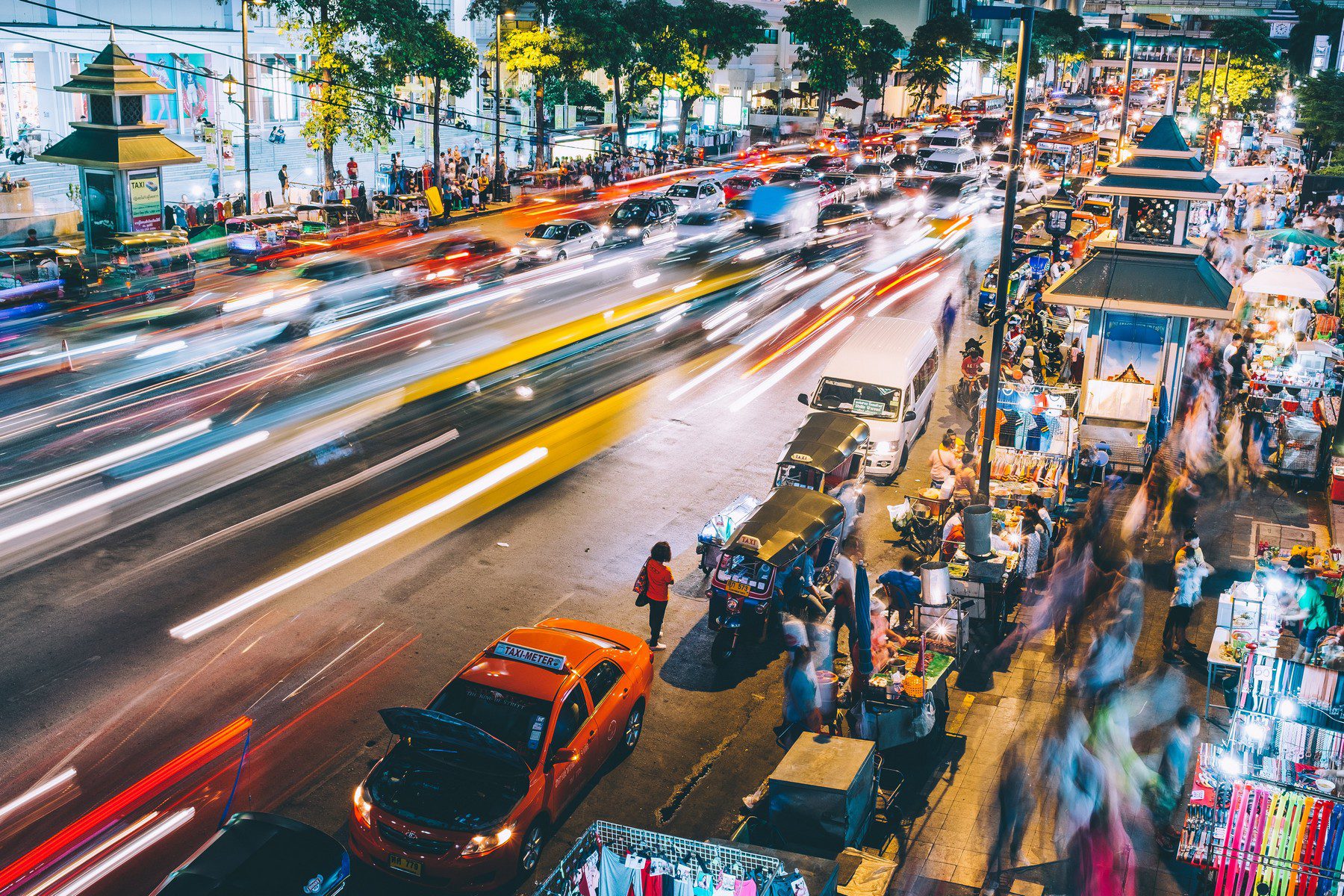 busy street at night with cars blurred