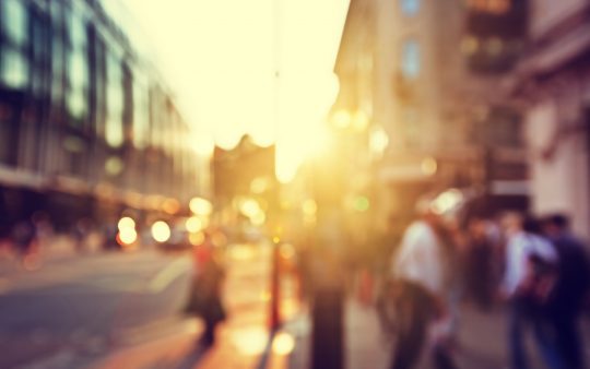 blurred city street with people