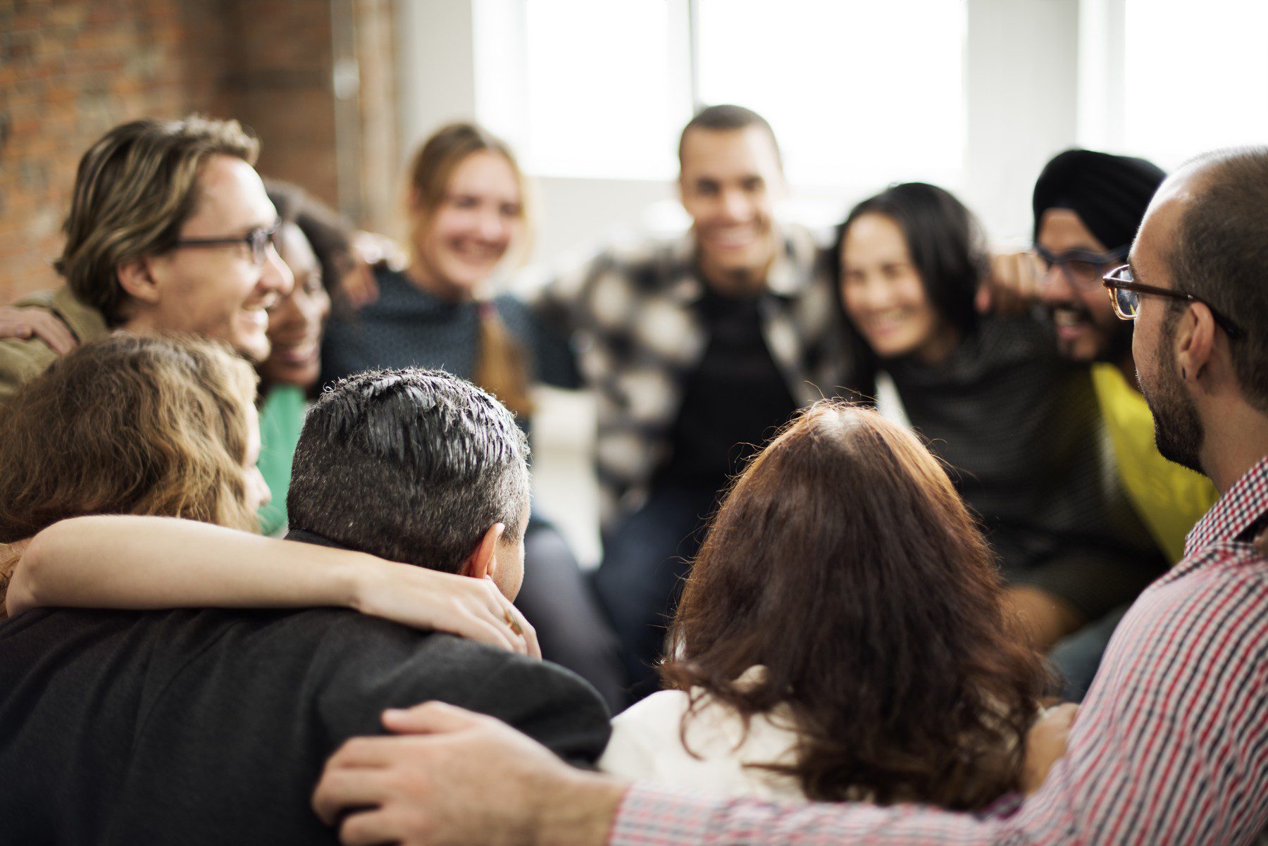 WirelessCar group hug people hugging in a circle