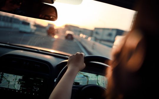 View from behind of a driver in a car