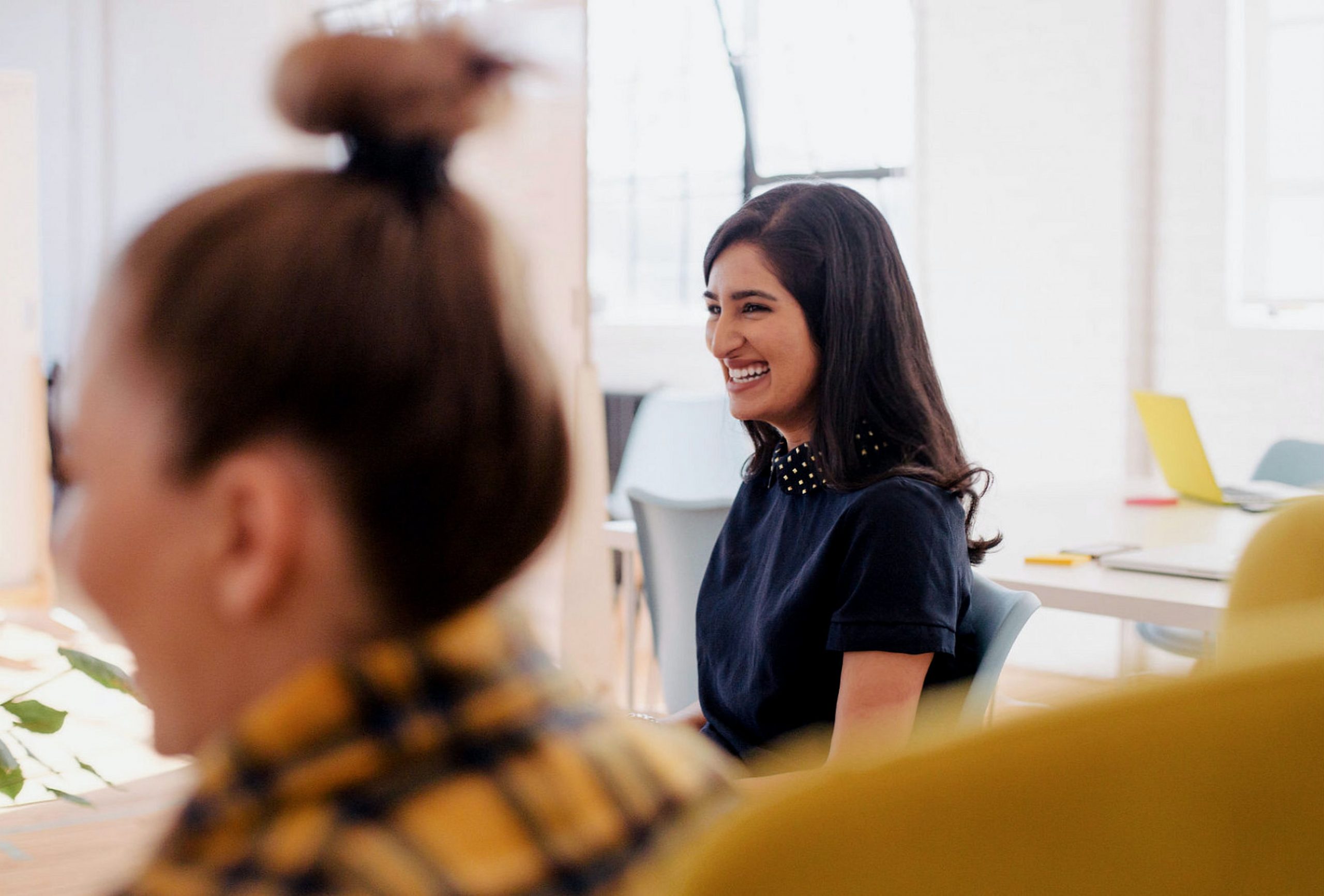 Person smiling and looking to the left