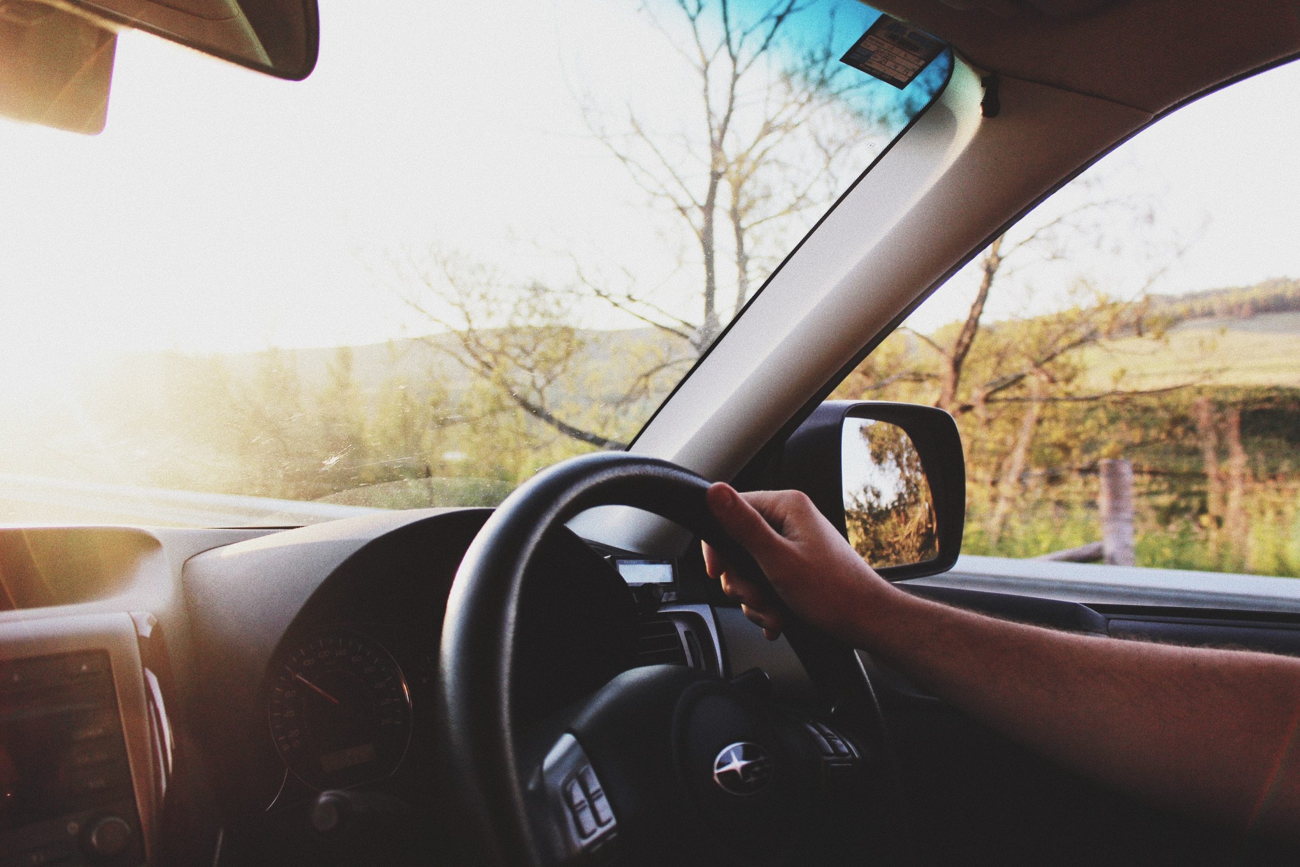 Close-up of driver holding the steering wheel