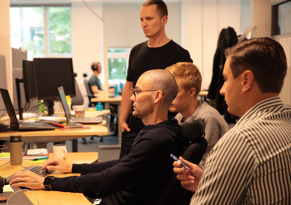 Group of people looking at a computer screen