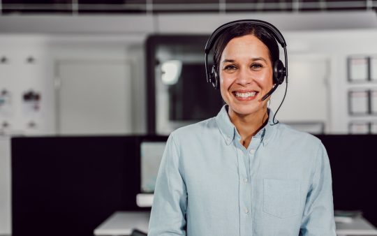 call center agent smiling with headphones