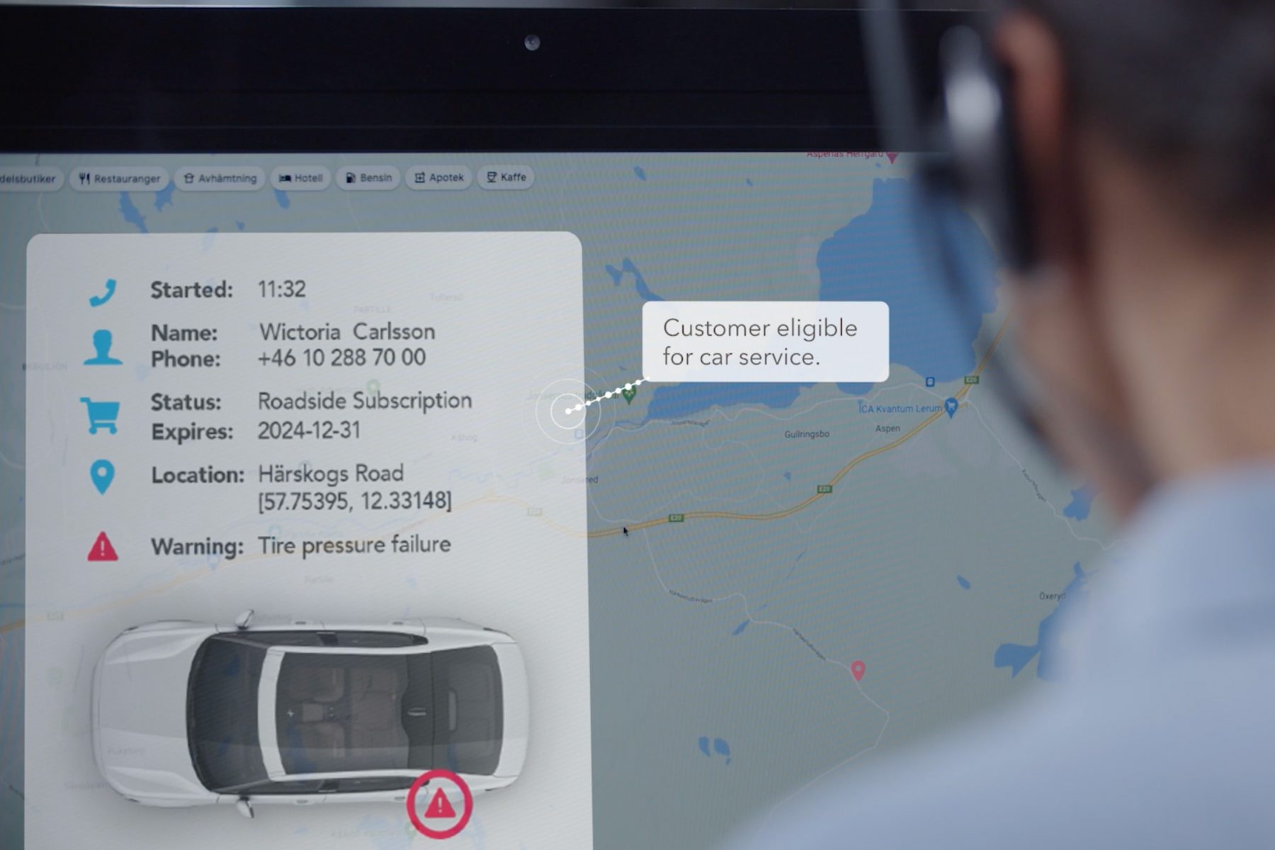 Call Center Services Call center agent looking at a screen with car information
