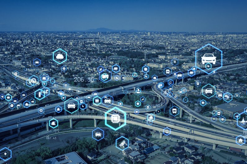 a city view with blue abstract icons floating across the image