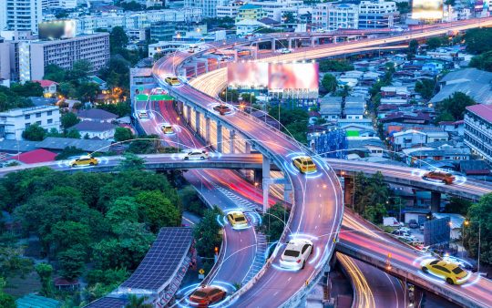 connected cars driving on a city highway