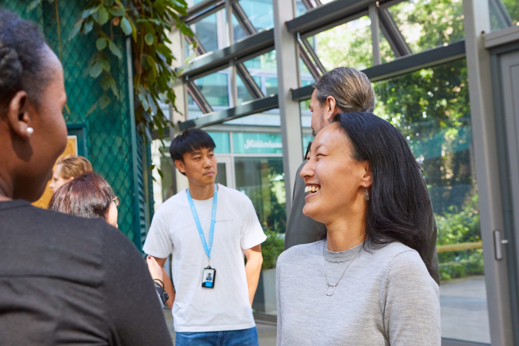 A group of people laughing and talking